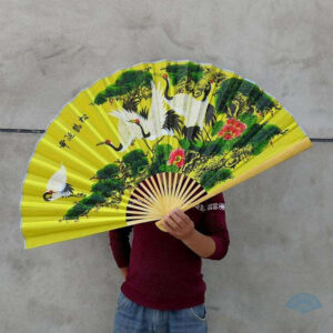 Éventail géant jaune pour décoration murale